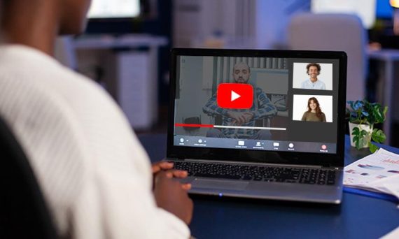 Paused YouTube video during a video call with visible participants